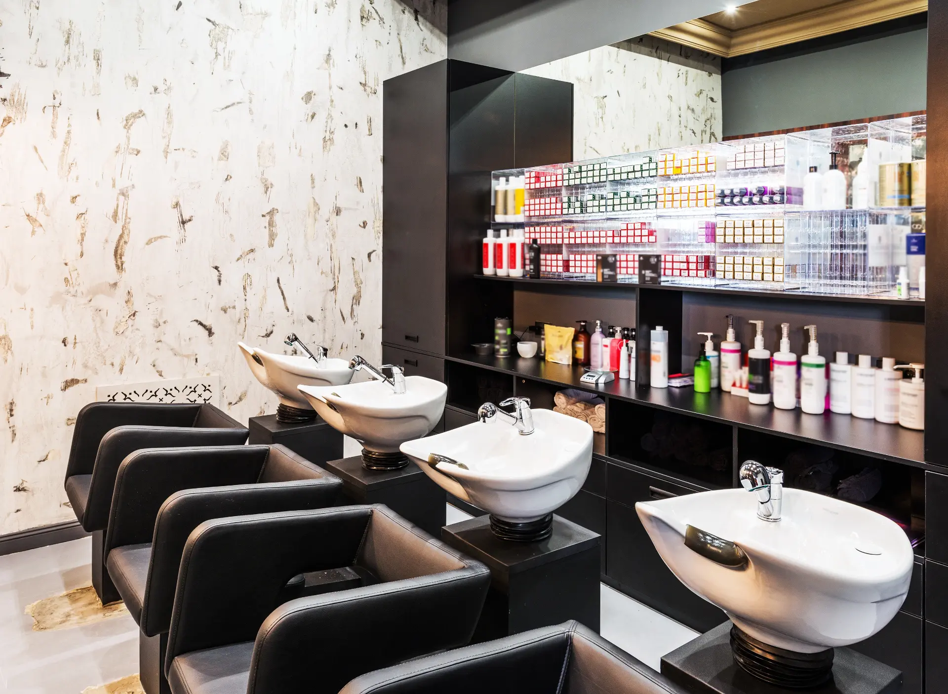 A customized salon setup with wash stations and organized product storage