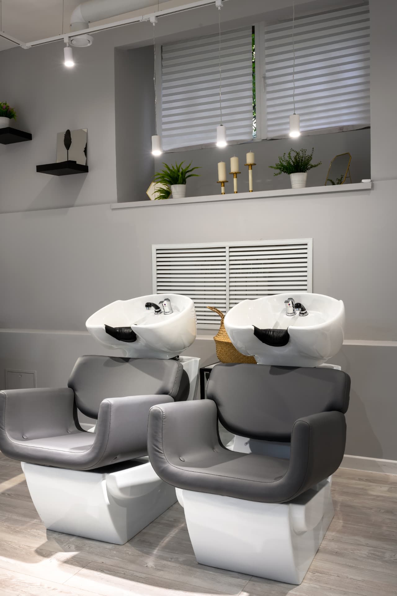Two professional shampoo stations in a salon suite